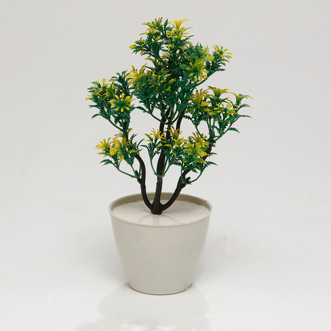 Greenish Yellow Artificial Plant: greenish yellow artificial plant in a small pot
