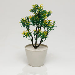 Greenish Yellow Artificial Plant: greenish yellow artificial plant in a small pot