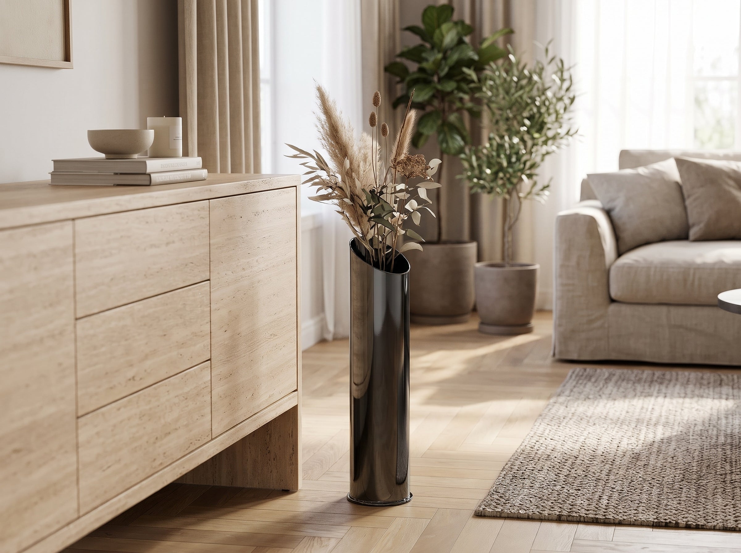 Noir Slant Floor Vase with dried pampas next to a sideboard in a living room