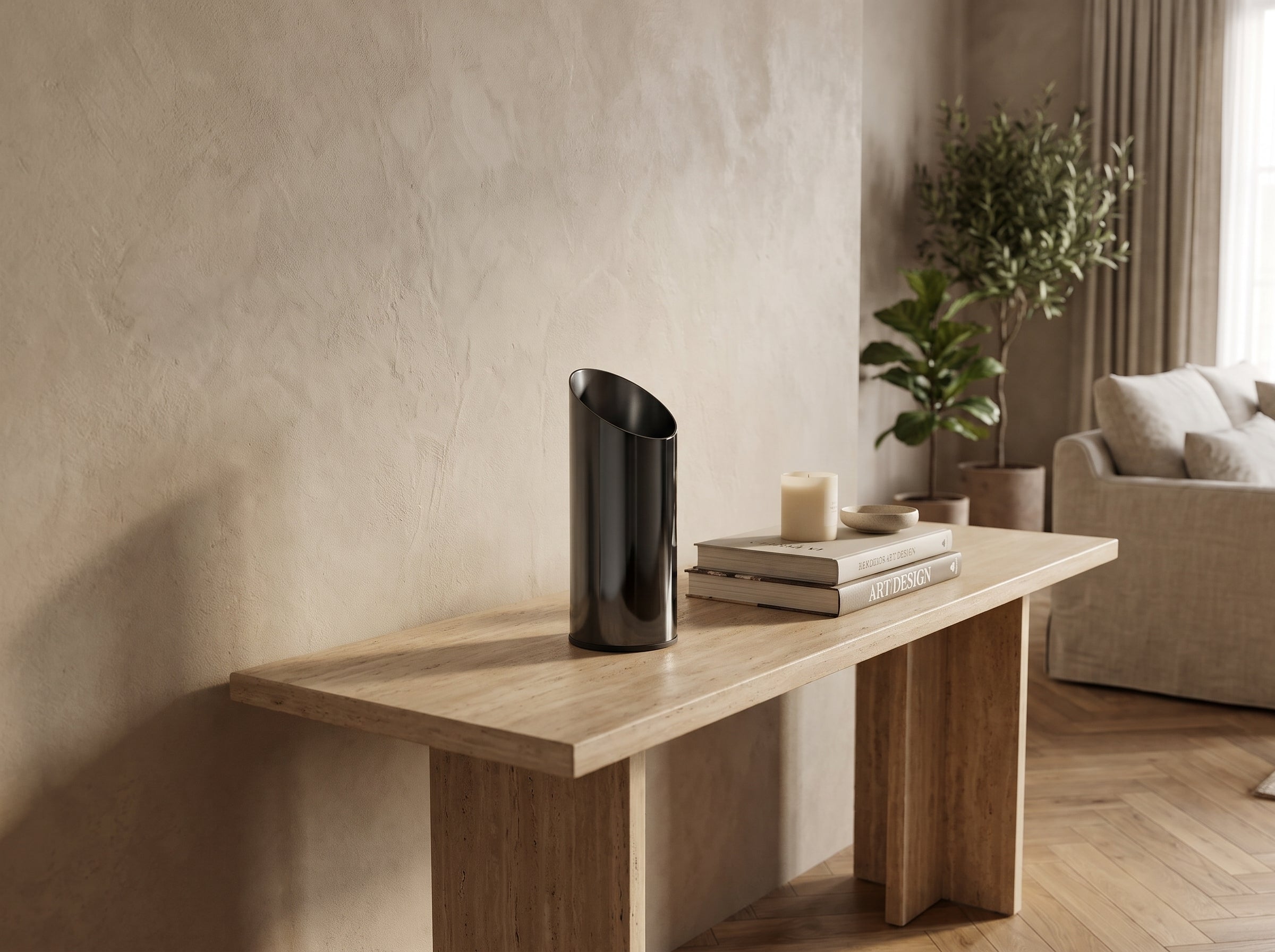 Small Noir Slant Vase on a stone console table beside a candle and stacked books
