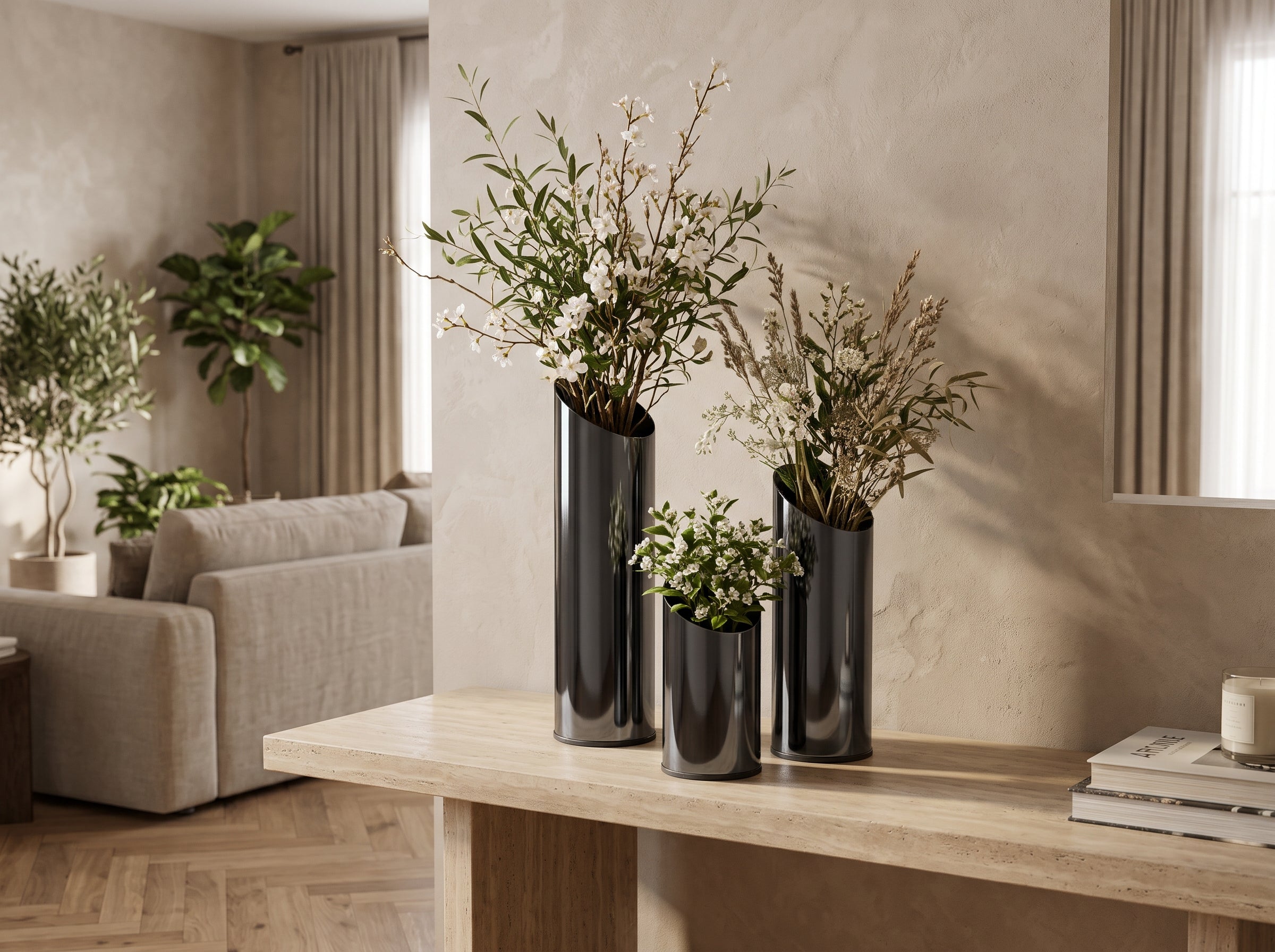 Noir Slant Vase Trio with dried stems and greenery on a console table