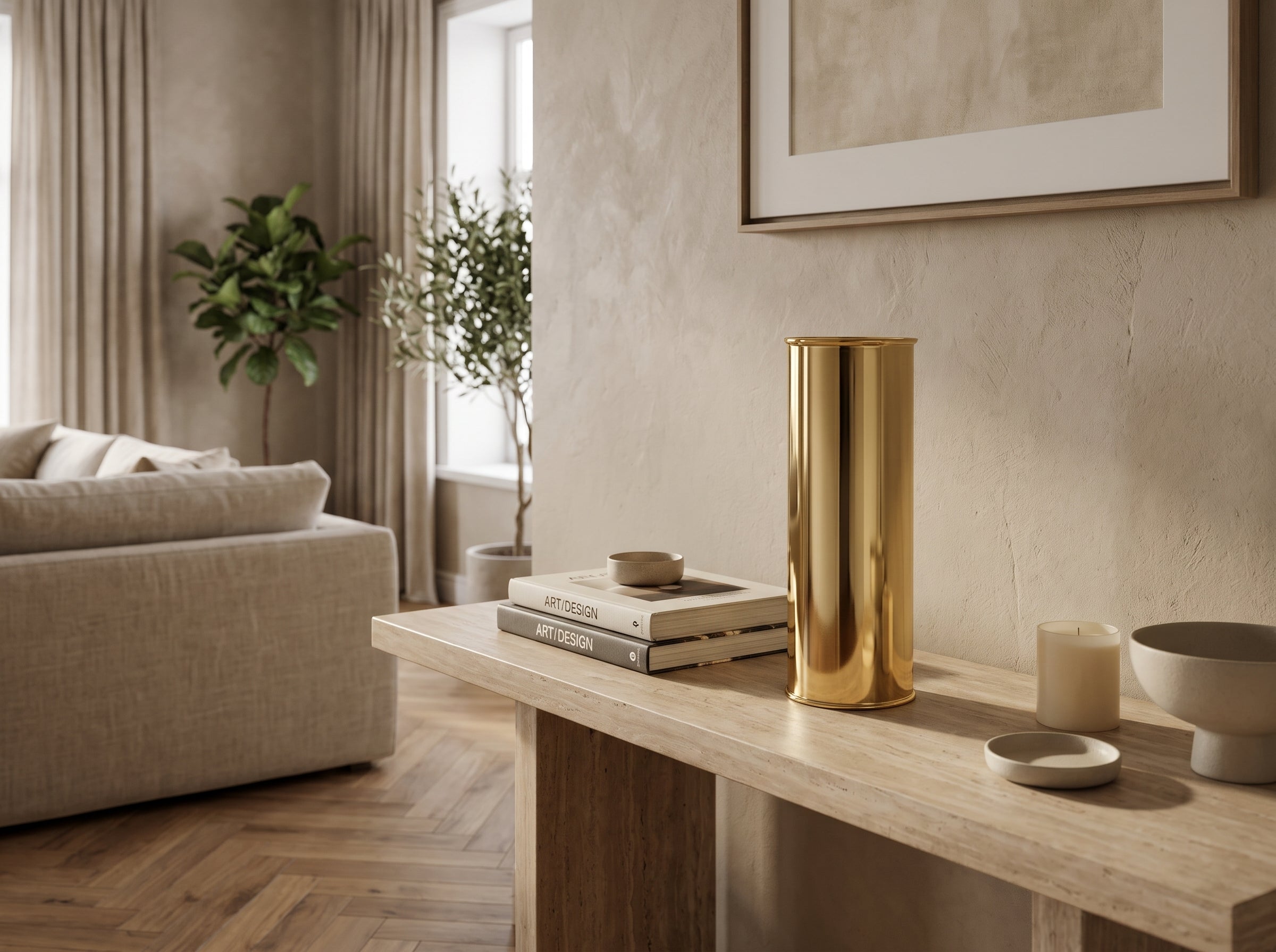 Medium Oro Cylinder Vase in gold on a console table under framed art