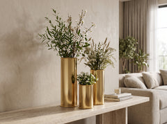 Oro Cylinder Vase Trio with fresh greenery and stems on a console table